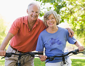 Photo of a man and woman on bicycles. Link to Life Stage Gift Planner Ages 60-70 Situations. Photo of a man and woman on bicycles. Link to Life Stage Gift Planner Ages 60-70 Situations.